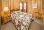 bedroom with bed and nightstand and chair