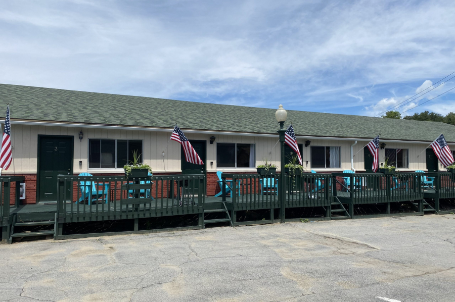 Decks outside motel room with chairs