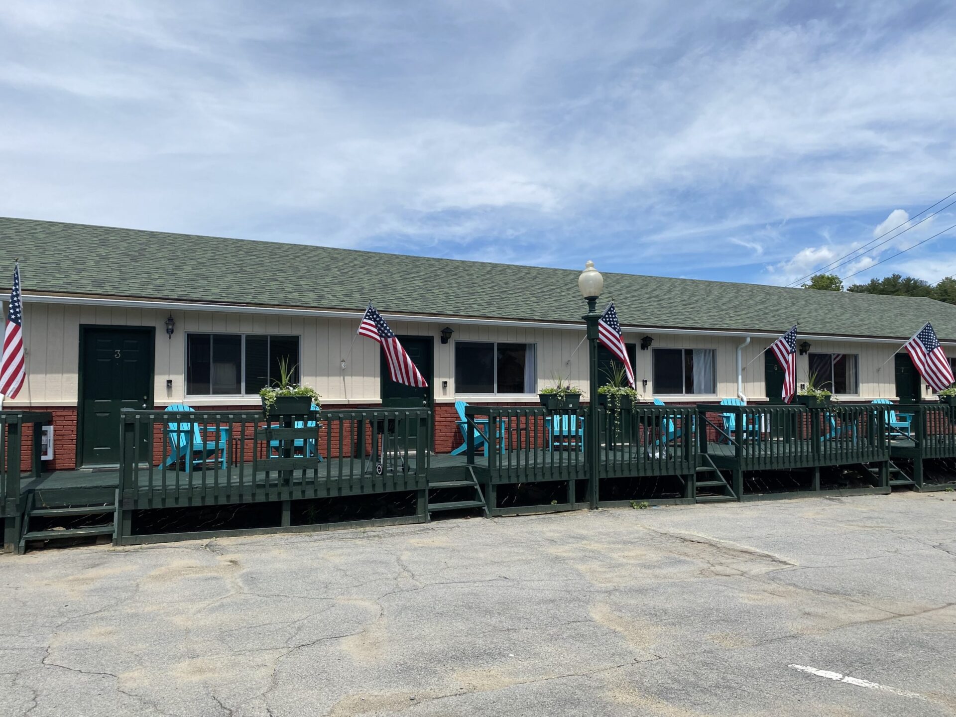 Decks outside motel room with chairs