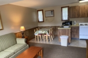 Kitchen, dining table and couch in cabin